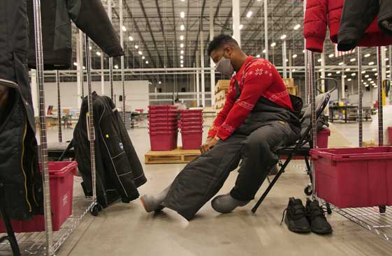   <p>McKesson worker putting on boots, snow pants, heavy jackets, gloves and hats to prepare to enter the freezer where cold pack vaccines are held.<br>  </p>  <p>&nbsp;</p>  