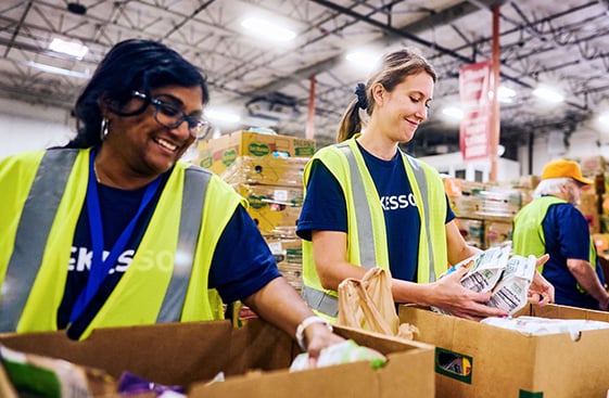 McKesson workers in a warehouse packing boxes