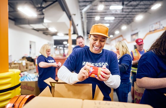 A McKesson warehouse worker packing a box