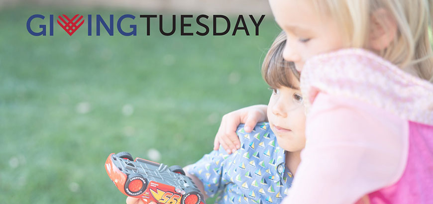 Two children hugging each other with the Giving Tuesday 2020 logo displayed
