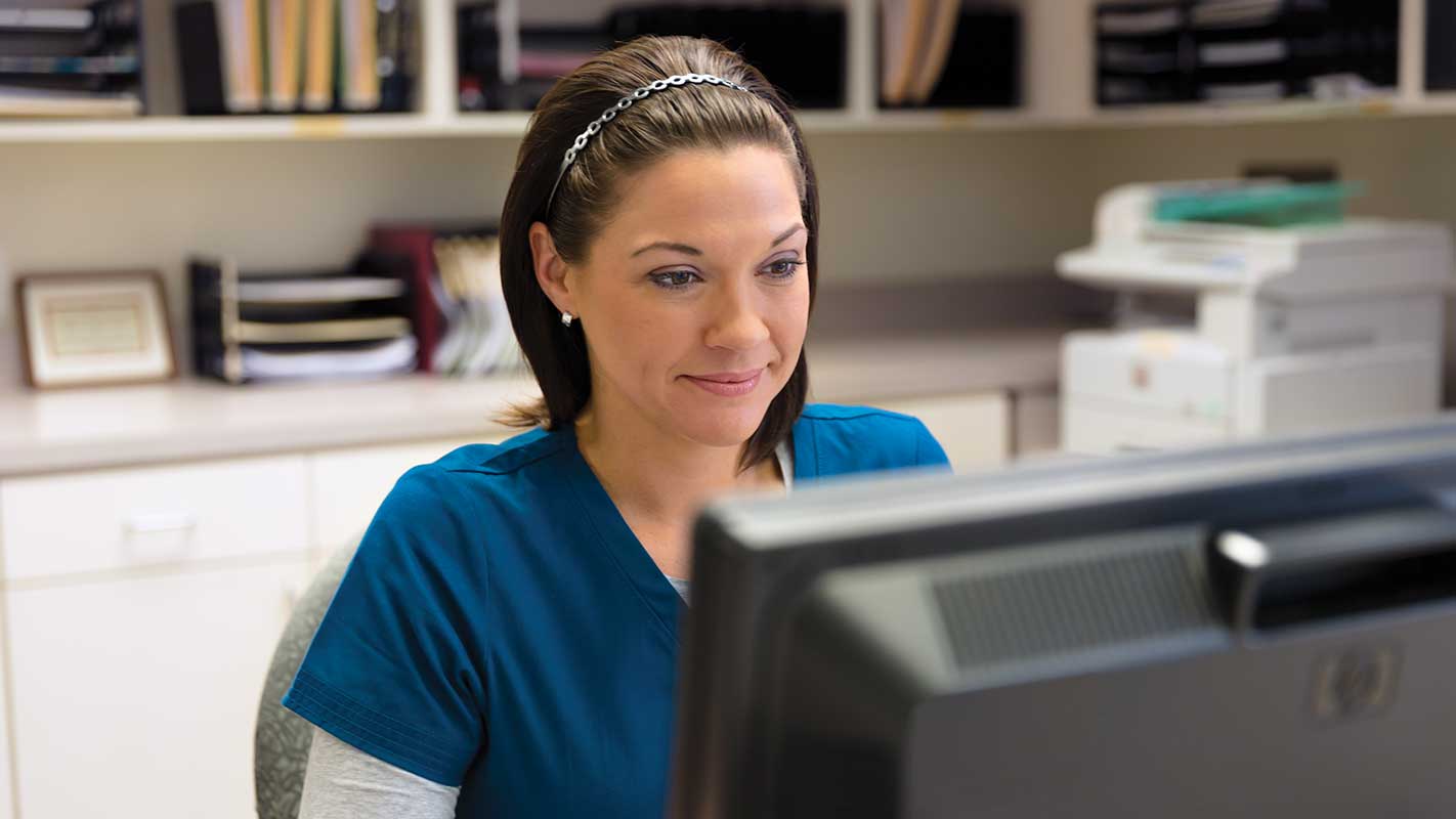 A nurse using a computer